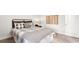 Bedroom featuring stylish furniture, a cozy bed, and a rustic wooden nightstand at 309 Glacier Way, Conway, SC 29526