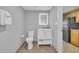 Bathroom with a white toilet, vanity, mirror, and tile flooring at 3000 N Ocean Blvd. # 220, Myrtle Beach, SC 29577