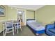 Comfortable bedroom featuring a queen-size bed, soft lighting, and beach-themed décor at 3000 N Ocean Blvd. # 220, Myrtle Beach, SC 29577