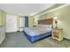 Comfortable bedroom with a queen-sized bed, nightstands, and natural light from the window at 3000 N Ocean Blvd. # 220, Myrtle Beach, SC 29577