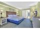 Serene bedroom features a plush queen bed, a bedside table, and a mounted TV at 3000 N Ocean Blvd. # 220, Myrtle Beach, SC 29577