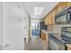 Functional kitchen with appliances, tile flooring and access to the balcony at 3000 N Ocean Blvd. # 220, Myrtle Beach, SC 29577