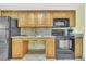 Well-lit kitchen with plenty of counter space, modern appliances, and neutral finishes at 3000 N Ocean Blvd. # 220, Myrtle Beach, SC 29577