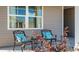Inviting front porch featuring comfortable seating with colorful pillows, perfect for relaxing outdoors at 308 Glacier Way, Conway, SC 29526