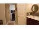 Elegant bathroom showcasing mosaic tiles, a granite vanity, and an adjoining walk-in closet at 3358 Pampas Dr., Myrtle Beach, SC 29577