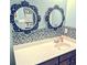 Charming bathroom boasting decorative mirrors, a vanity, and stylish tiled backsplash at 3358 Pampas Dr., Myrtle Beach, SC 29577
