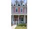 Charming two-story townhouse with a inviting front porch and colorful details at 3358 Pampas Dr., Myrtle Beach, SC 29577