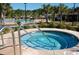 Inviting hot tub with easy access steps, perfect for relaxing and enjoying the surrounding tropical scenery at 3358 Pampas Dr., Myrtle Beach, SC 29577