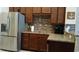 Well-equipped kitchen featuring granite countertops, stainless steel refrigerator, and complementary backsplash at 3358 Pampas Dr., Myrtle Beach, SC 29577