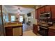Open concept kitchen with granite counters, stainless appliances, and seamless flow to the living area at 3358 Pampas Dr., Myrtle Beach, SC 29577