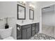 Bathroom with double vanity with dark cabinets, decorative tile, and stylish lighting at 383 Hayloft Circle, Conway, SC 29526