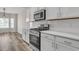 Modern kitchen featuring stainless steel oven and cooktop, bright white subway tiles at 383 Hayloft Circle, Conway, SC 29526