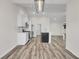 Modern kitchen with white cabinets, stainless steel appliances, and a large center island at 383 Hayloft Circle, Conway, SC 29526