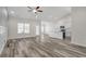 Spacious living area with vaulted ceilings and plank flooring leading to the kitchen at 383 Hayloft Circle, Conway, SC 29526