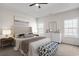 Spacious main bedroom with tray ceiling, ensuite bath, and ample natural light at 383 Hayloft Circle, Conway, SC 29526