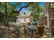 Outdoor dining table with seating next to the pool house and plunge pool in this backyard retreat at 4003 N Ocean Blvd., Myrtle Beach, SC 29577