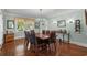 Elegant dining room with a large table, stylish lighting, and beautiful hardwood floors, ideal for entertaining at 4003 N Ocean Blvd., Myrtle Beach, SC 29577