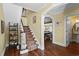 Inviting foyer with hardwood floors, carpeted staircase, and view of a billiards room at 4003 N Ocean Blvd., Myrtle Beach, SC 29577