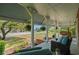 Inviting front porch features a swing, comfortable seating, and hanging ferns creating a relaxing outdoor space at 4003 N Ocean Blvd., Myrtle Beach, SC 29577