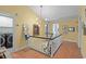 Upstairs hallway with wood floors, laundry room, and bathroom access at 4003 N Ocean Blvd., Myrtle Beach, SC 29577