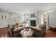 Bright living room with a fireplace, hardwood floors, comfortable seating, and plenty of natural light at 4003 N Ocean Blvd., Myrtle Beach, SC 29577
