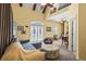 Spacious living room with ample natural light flowing from a large window and glass doors to the backyard at 4003 N Ocean Blvd., Myrtle Beach, SC 29577