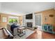 Comfortable living room with fireplace, TV, pool table, and natural light through large windows at 4003 N Ocean Blvd., Myrtle Beach, SC 29577