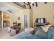 Open-concept living room boasts vaulted ceilings, a cozy seating area, and a unique loft space at 4003 N Ocean Blvd., Myrtle Beach, SC 29577