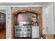 Close-up of professional grade Viking range with brick surround in stylish residential kitchen at 4003 N Ocean Blvd., Myrtle Beach, SC 29577