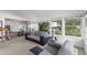 Cozy sunroom with neutral tones, large windows offering natural light and backyard views at 4003 N Ocean Blvd., Myrtle Beach, SC 29577