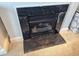 Close-up of modern gas fireplace with black marble surround at 407 24Th Ave. N # 302, North Myrtle Beach, SC 29582