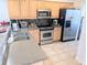 Well-lit kitchen featuring stainless steel appliances and light wood cabinets at 407 24Th Ave. N # 302, North Myrtle Beach, SC 29582
