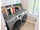Laundry room with modern side-by-side washer and dryer and tile flooring at 407 24Th Ave. N # 302, North Myrtle Beach, SC 29582
