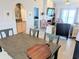 Open living area with dining table, breakfast bar, and entry to main bedroom at 407 24Th Ave. N # 302, North Myrtle Beach, SC 29582