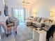 Open living area featuring comfortable seating and a fireplace at 407 24Th Ave. N # 302, North Myrtle Beach, SC 29582