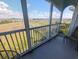 Enjoy scenic views of the marsh from this screened-in porch with seating at 407 24Th Ave. N # 302, North Myrtle Beach, SC 29582