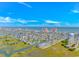 Expansive aerial view captures a coastal town by the sea with winding canals and clear blue skies at 414 32Nd Ave. N, North Myrtle Beach, SC 29582