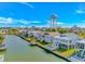 Homes line canal with community water tower and city skyline visible from this picturesque coastal community at 414 32Nd Ave. N, North Myrtle Beach, SC 29582