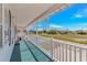 Relaxing covered porch, perfect for enjoying scenic neighborhood views at 414 32Nd Ave. N, North Myrtle Beach, SC 29582