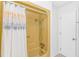 Bathroom showcasing a vintage yellow bathtub and shower, paired with white walls and tile flooring at 414 32Nd Ave. N, North Myrtle Beach, SC 29582
