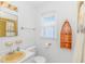 Clean and bright bathroom with a yellow sink and toilet at 414 32Nd Ave. N, North Myrtle Beach, SC 29582