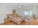 Bright bedroom featuring a slider to the porch, ceiling fan and wood laminate flooring at 414 32Nd Ave. N, North Myrtle Beach, SC 29582