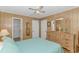 Bedroom with natural wood paneling, ceiling fan, and light colored wood laminate flooring at 414 32Nd Ave. N, North Myrtle Beach, SC 29582
