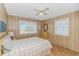Cozy bedroom featuring a comfortable bed, a ceiling fan and windows offering ample natural light at 414 32Nd Ave. N, North Myrtle Beach, SC 29582