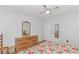 This bedroom features matching furniture, a ceiling fan, and light colored wood laminate flooring at 414 32Nd Ave. N, North Myrtle Beach, SC 29582