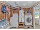 Functional laundry room with washer, dryer, and water heater, maximizing utility and space at 414 32Nd Ave. N, North Myrtle Beach, SC 29582