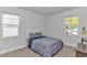 Calm bedroom with neutral palette, plush carpet, and natural light from the double windows at 456 Cattle Drive Circle, Myrtle Beach, SC 29588