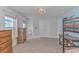 Bright bedroom with a bunk bed, dresser, double door closet, window and a light fixture at 456 Cattle Drive Circle, Myrtle Beach, SC 29588