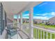 Inviting front porch with seating and neighborhood views under a bright blue sky at 456 Cattle Drive Circle, Myrtle Beach, SC 29588