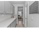 Hallway with modern cabinets and decor leading to a sunlit seating area at 456 Cattle Drive Circle, Myrtle Beach, SC 29588